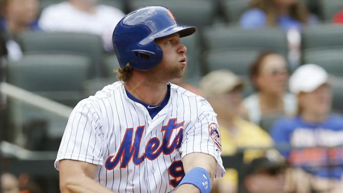 New York Mets Kirk Nieuwenhuis (9) hits a third-inning, two-run, home run, his second home run of the game, in a baseball game against the Arizona Diamondbacks in New York, Sunday, July 12, 2015. (AP Photo/Kathy Willens)